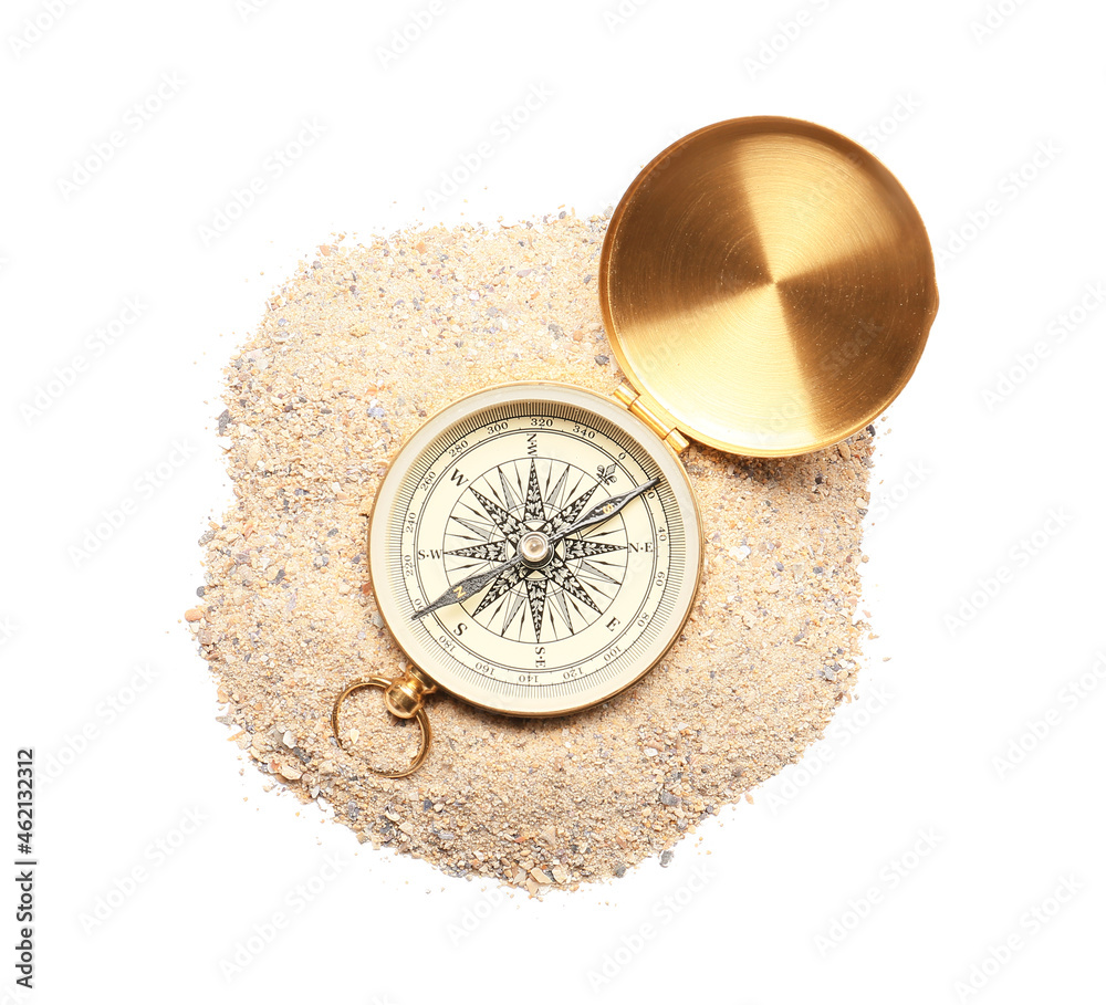 Vintage compass and sand on white background