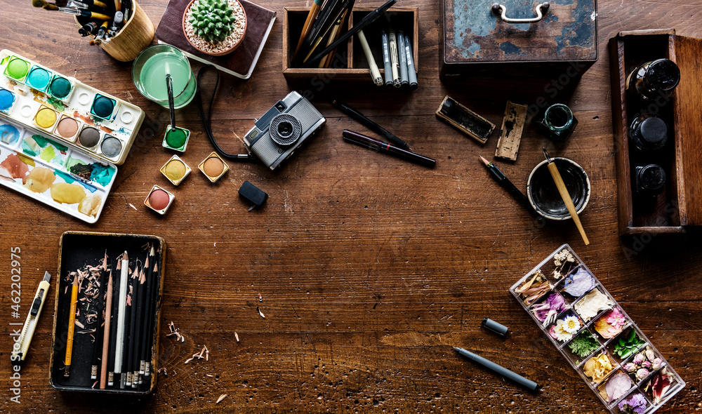 Aerial view of artistic euqipments painting tools on wooden table