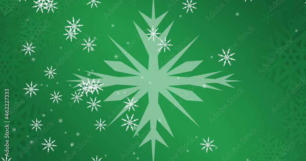 Image of snow falling over snowflakes at christmas, on green background