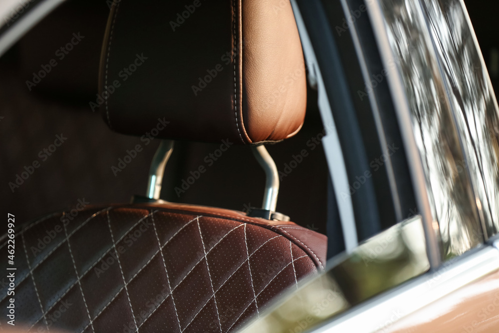 Leather headrest in modern car, closeup