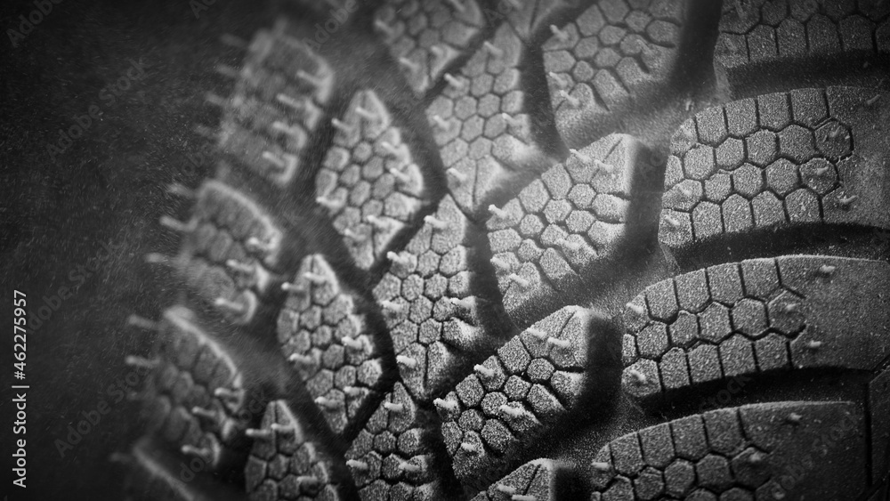 Winter Car tire with snow in detail