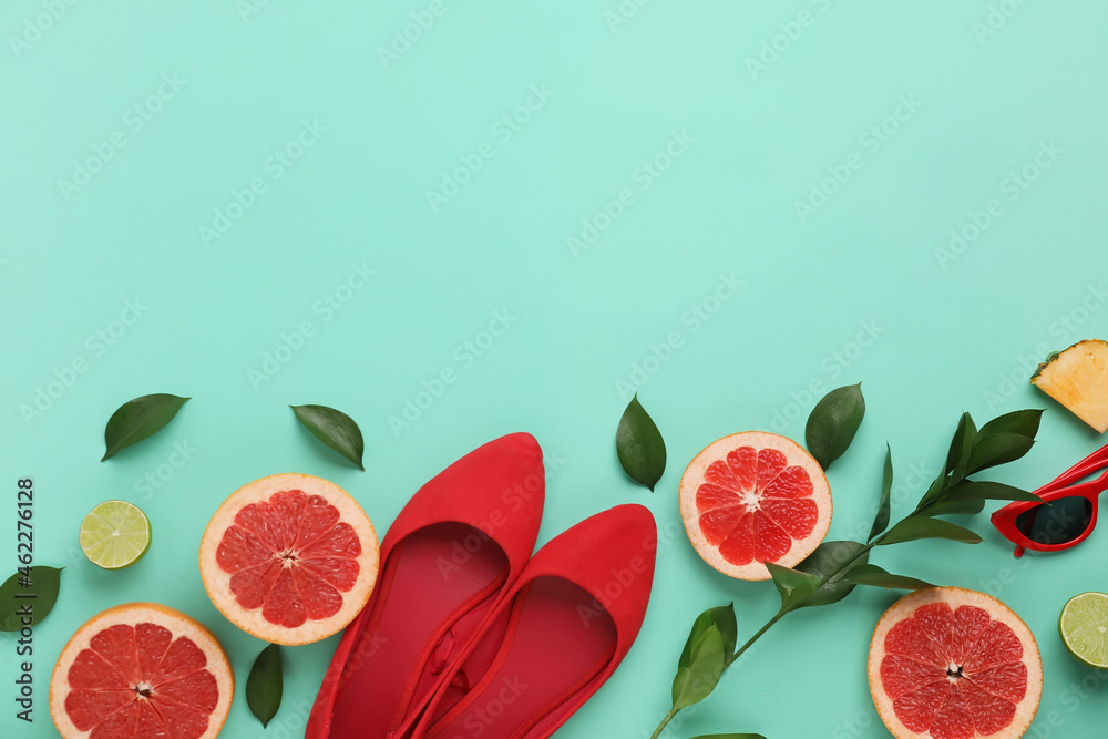 Composition with stylish shoes and fruits on color background