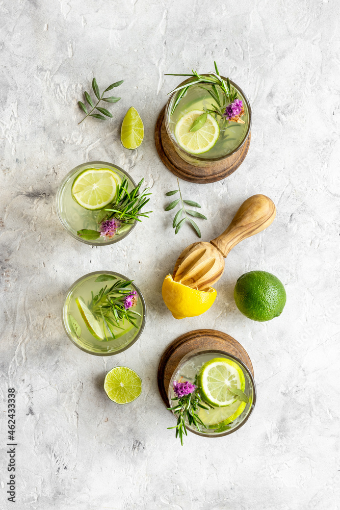 Homemade herbal soda drink with lemon slices and herbs