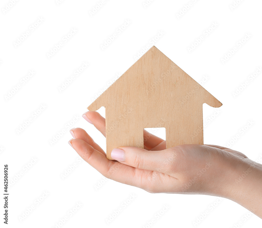 Woman with wooden house on white background