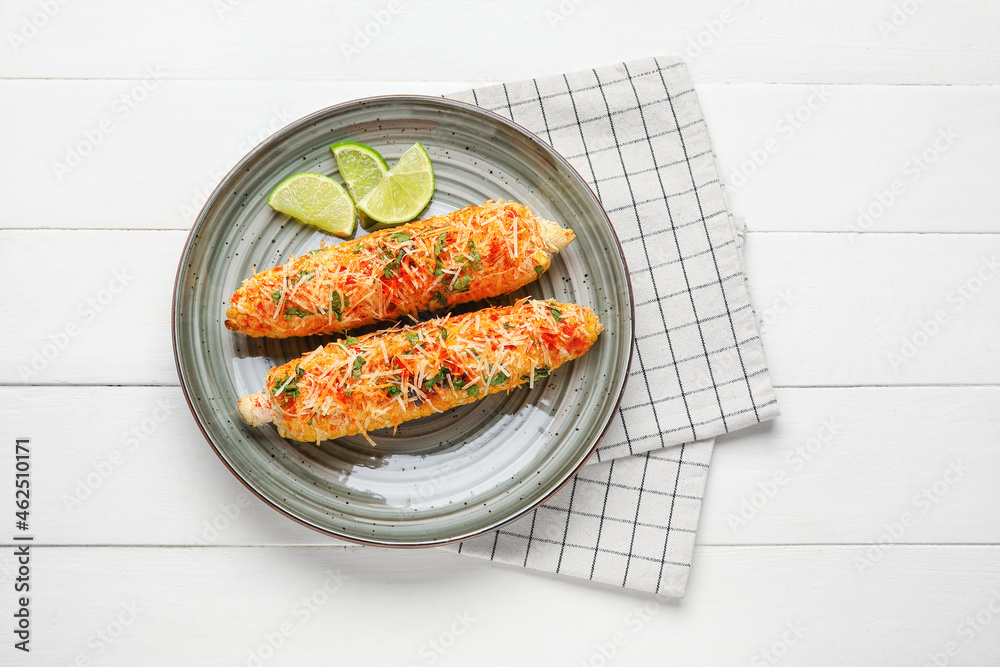 Plate with tasty Elote Mexican Street Corn on white wooden background