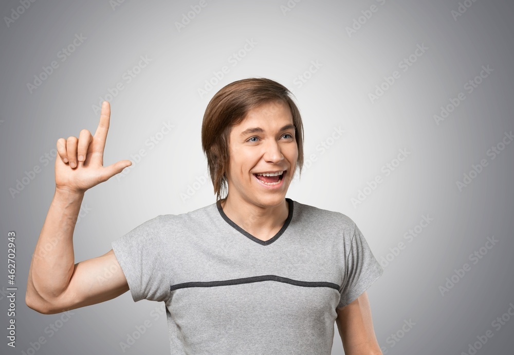 Portrait of an excited man smiling and looking at the camera