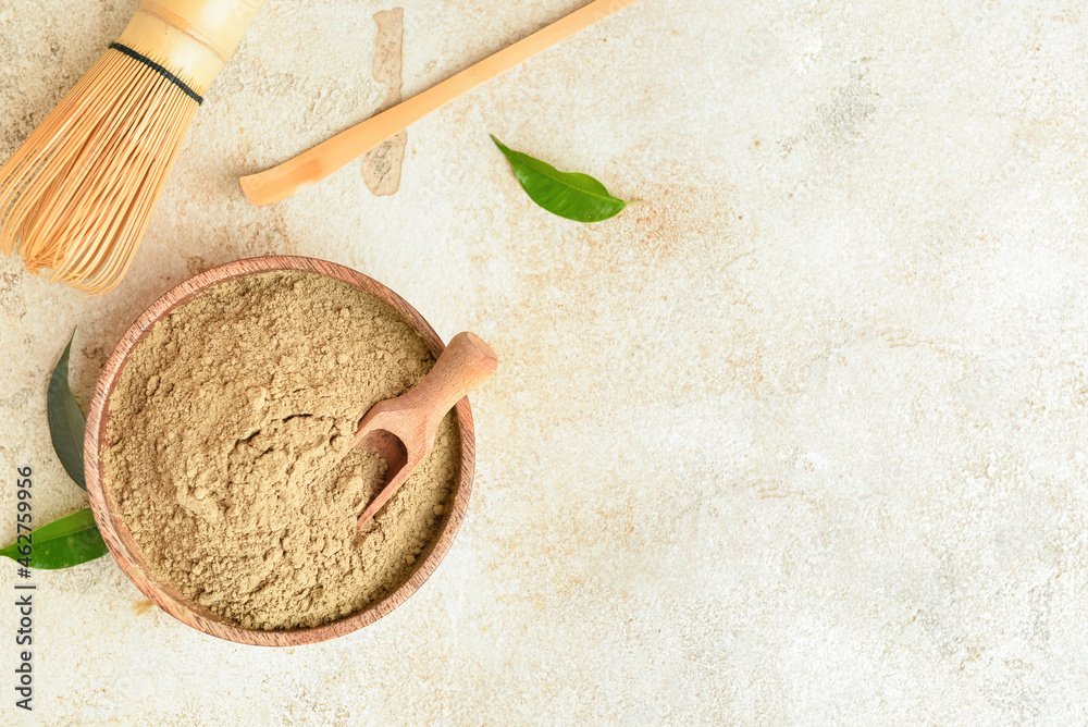 Bowl of hojicha powder on light background