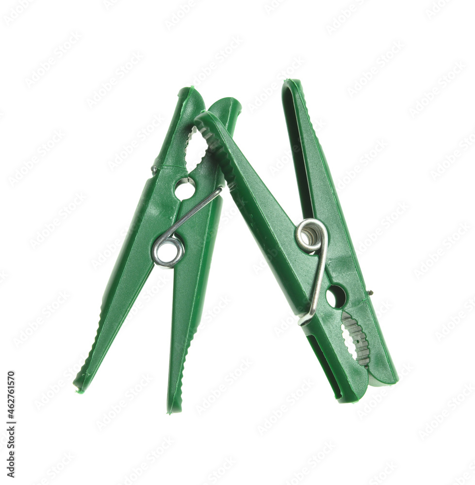 Green plastic clothespins isolated on white background