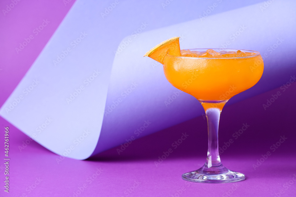 Glass with delicious melon cocktail on color background