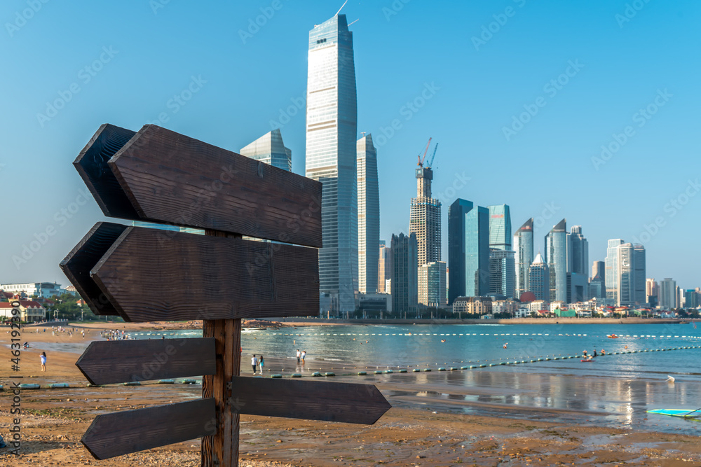 Wooden sign and building complex background