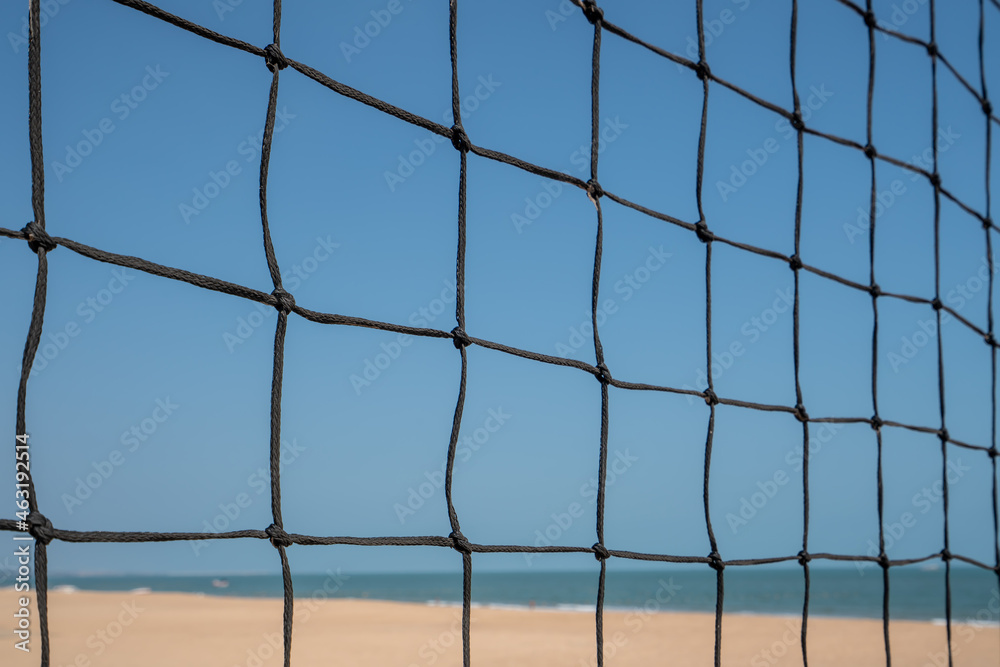 Beach volleyball court with an ocean background. Summer sport concept