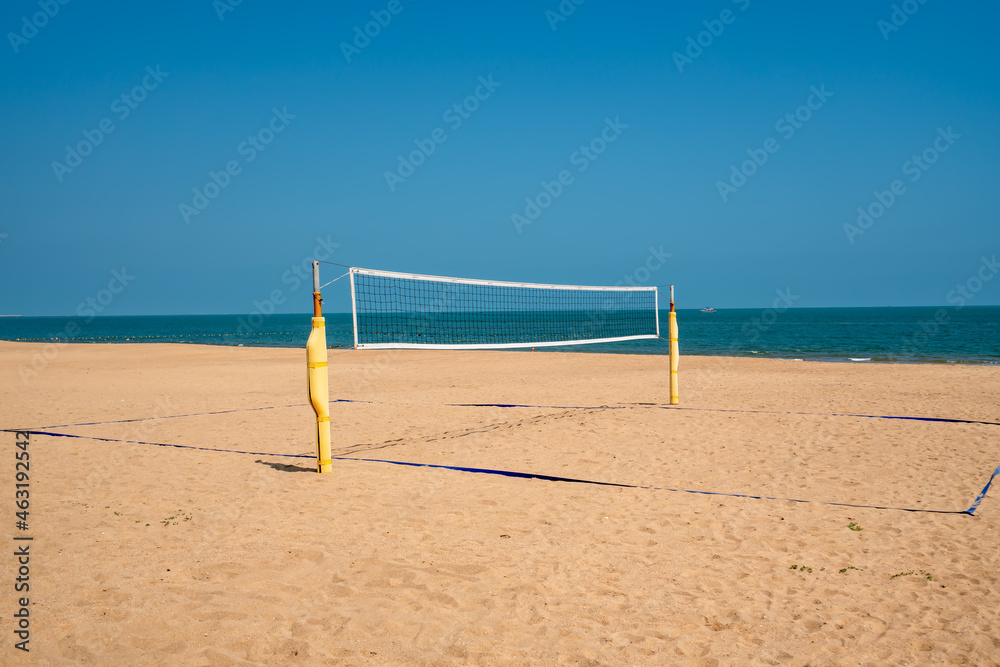 Beach volleyball court with an ocean background. Summer sport concept