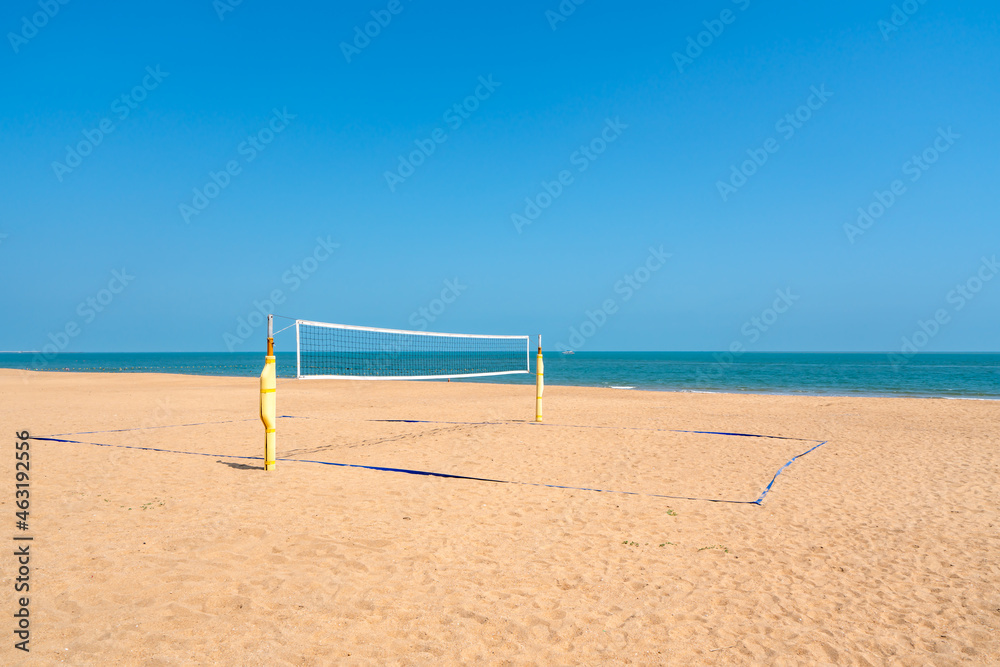 Beach volleyball court with an ocean background. Summer sport concept