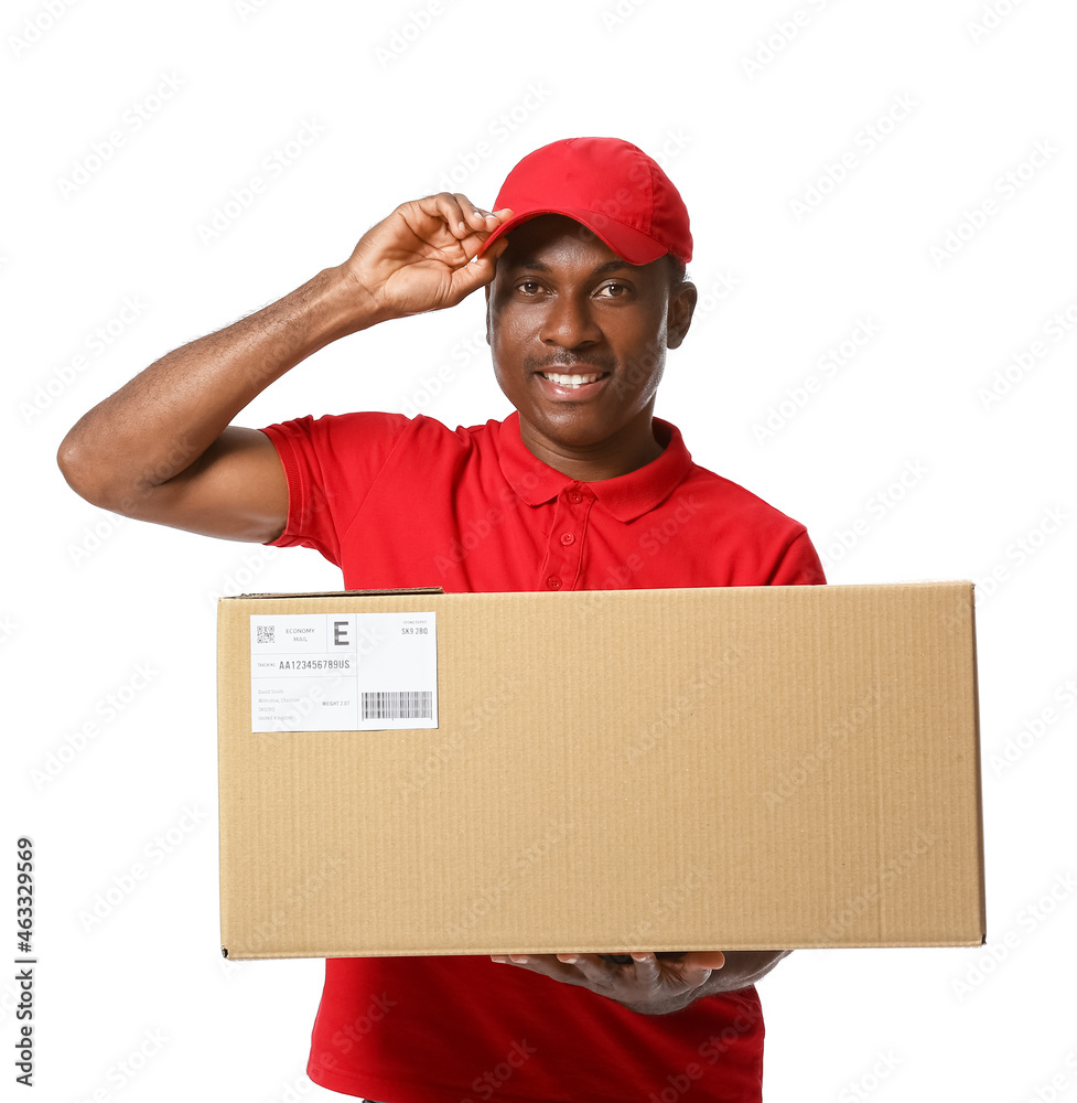 African-American delivery man with parcel on white background