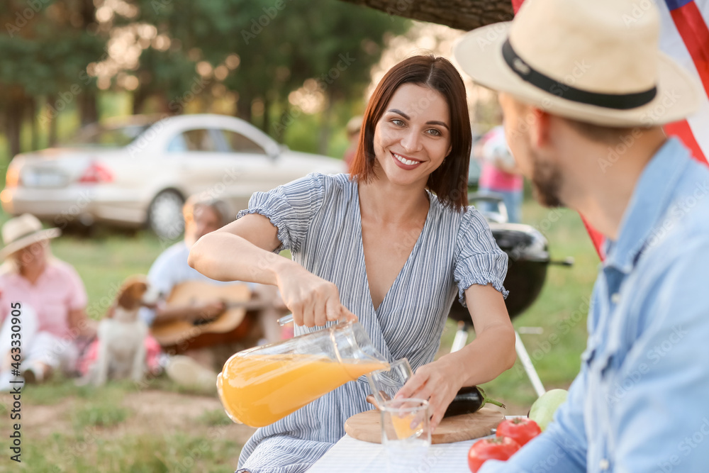 Happy couple at barbecue party on summer day