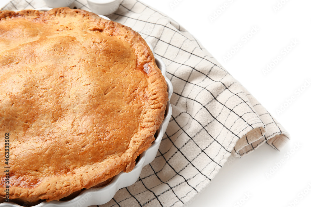 Baking dish with tasty chicken pot pie on white background, closeup