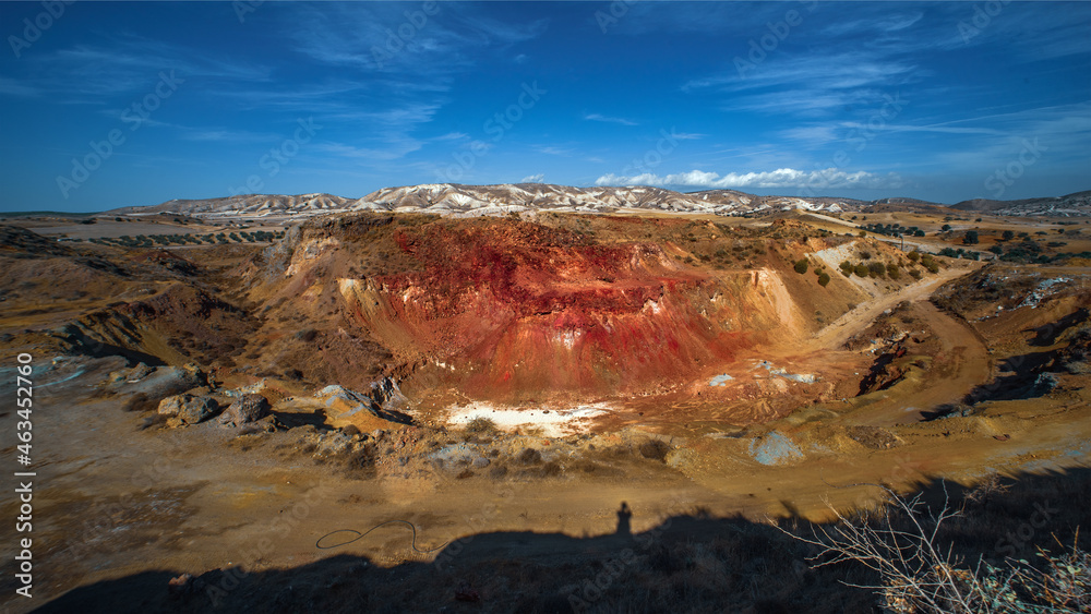 Troulloi copper mine in Larnaca area, Cyprus. Abandoned open pit and red cap (gossan) rich with iron