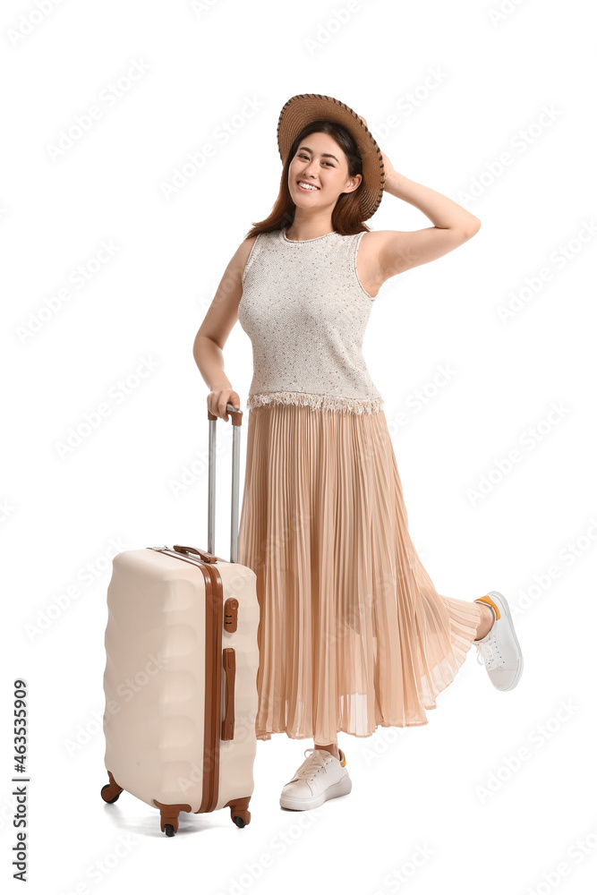 Young woman with suitcase on white background