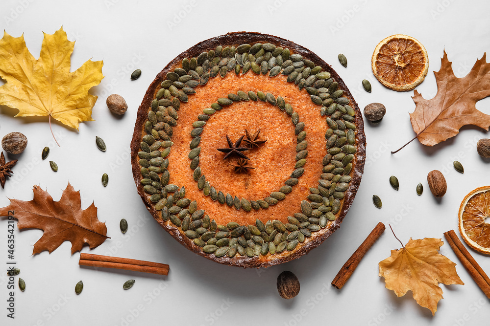 Composition with delicious pumpkin pie on light background