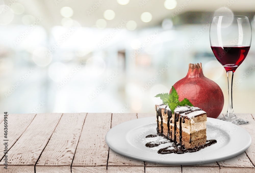 traditional food with pomegranate, nut sauce and a glass of wine