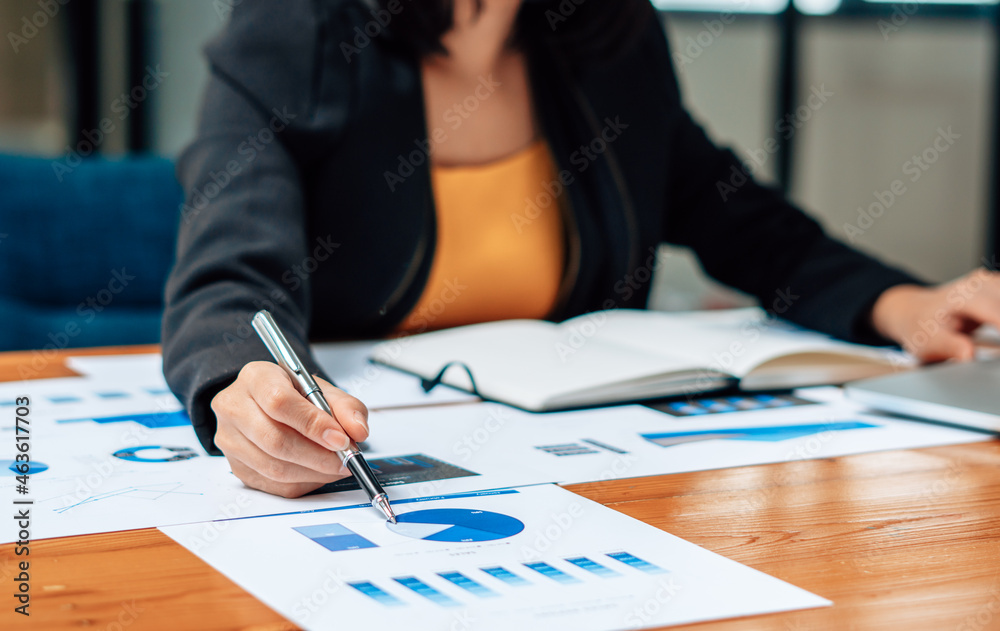 Close up of accountant or banker checking investment results, calculates financial savings, calculat