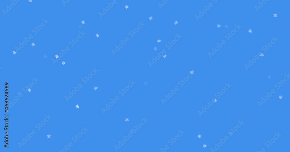 Glowing snow particles falling against blue background