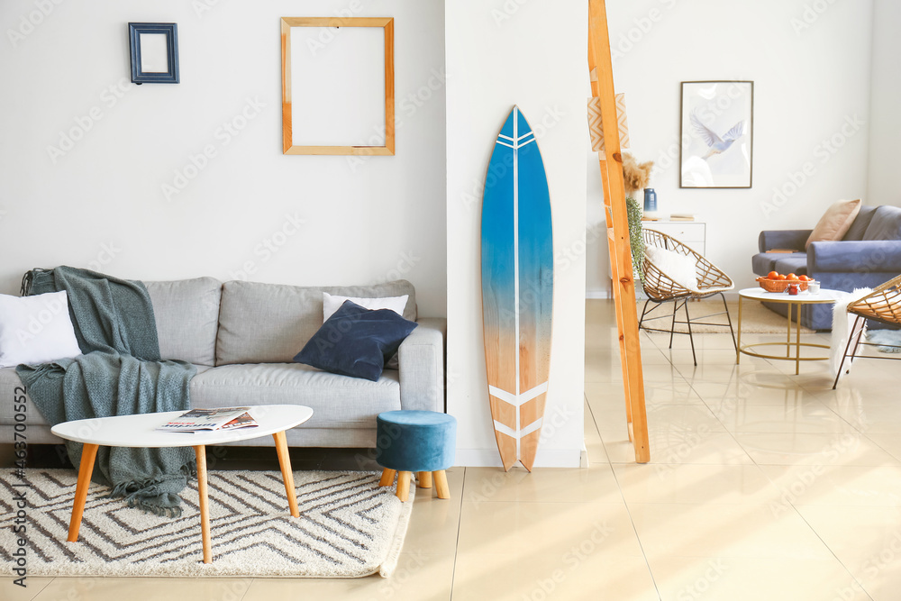 Interior of modern room with stylish surfboard