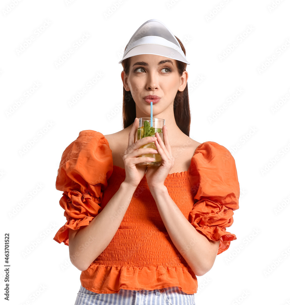 Beautiful young woman with fresh lemonade on white background