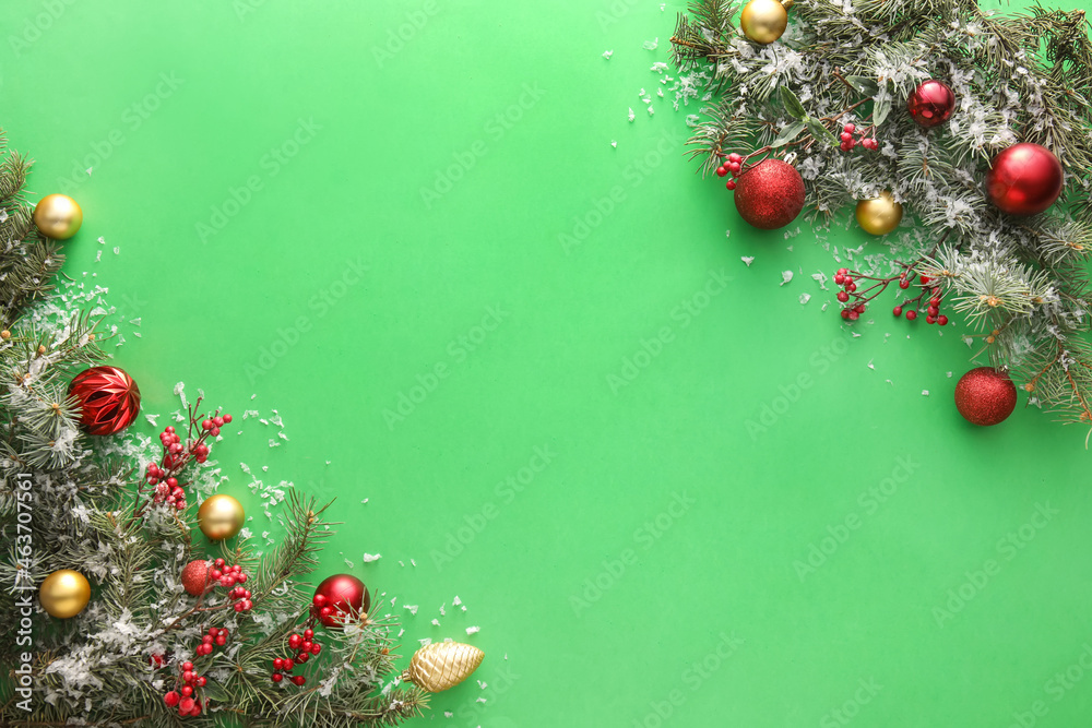 Christmas composition with fir branches and decorations on green background, closeup