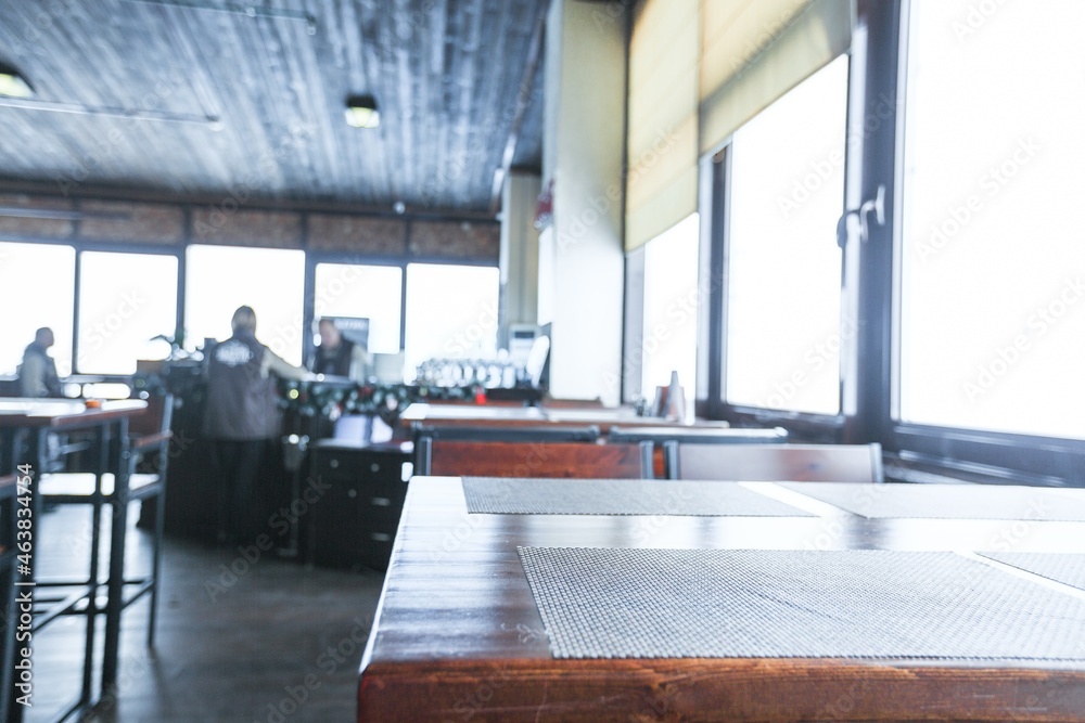 cafe restaurant or coffee shop with abstract bokeh lights defocused blur background with table for p