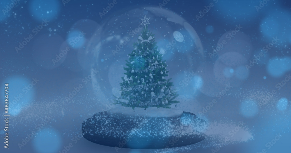 Image of spots of lights falling over snow globe in winter scenery