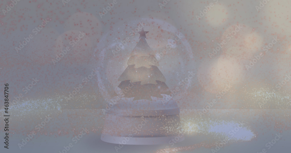 Image of lights spots falling over snow globe on grey background