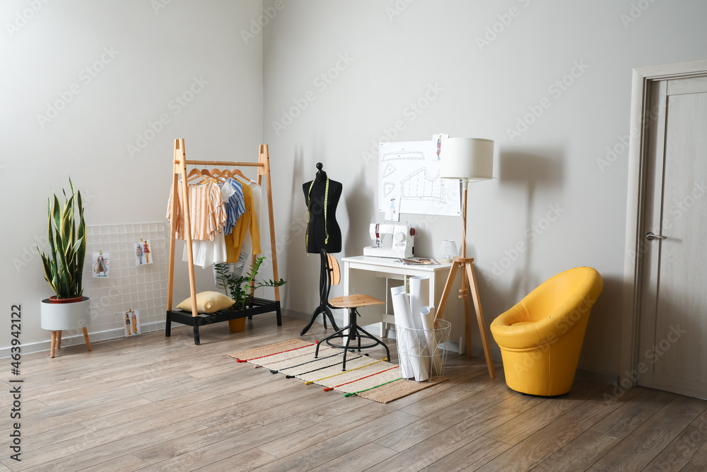 Tailors workplace with mannequin in modern atelier