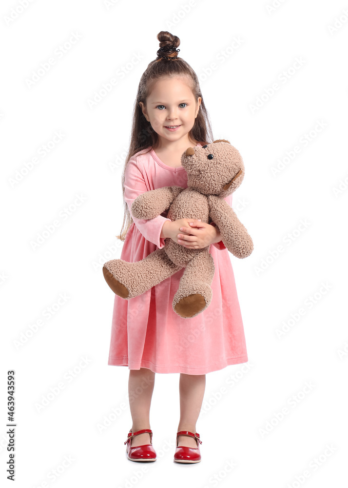 Adorable little girl with teddy bear on white background