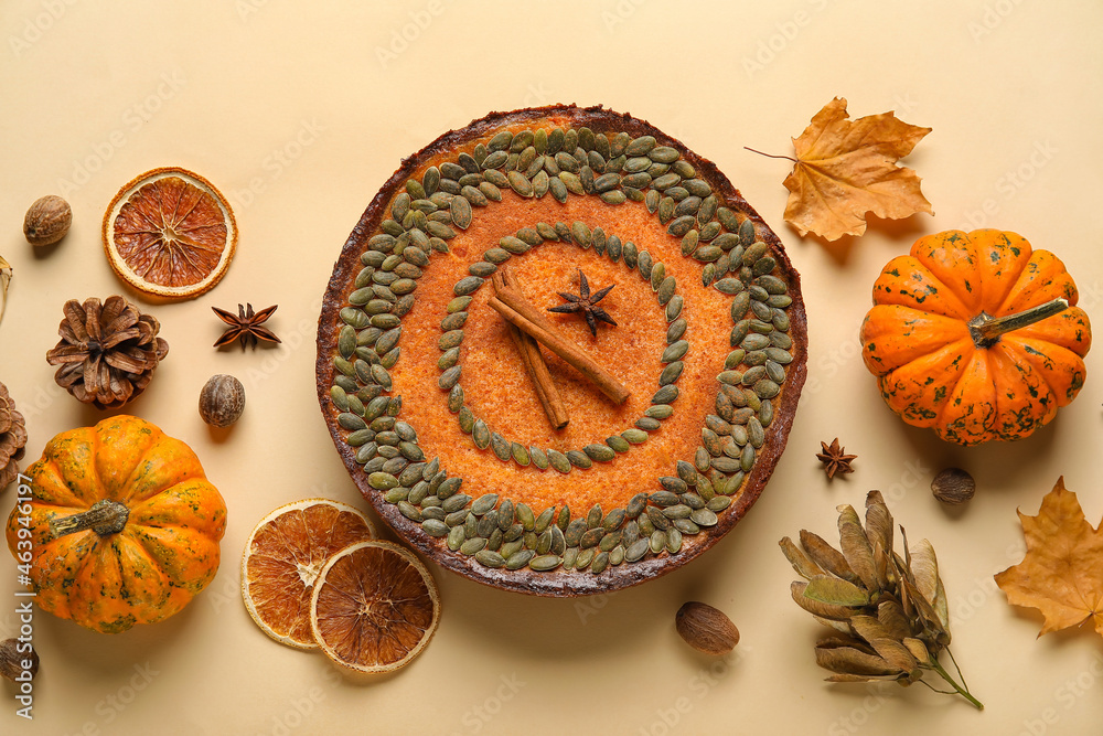 Composition with delicious pumpkin pie on beige background