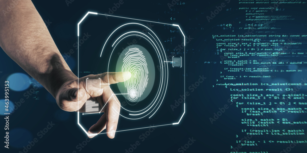 Businessperson hand pointing at glowing finger print interface on dark background with coding langua