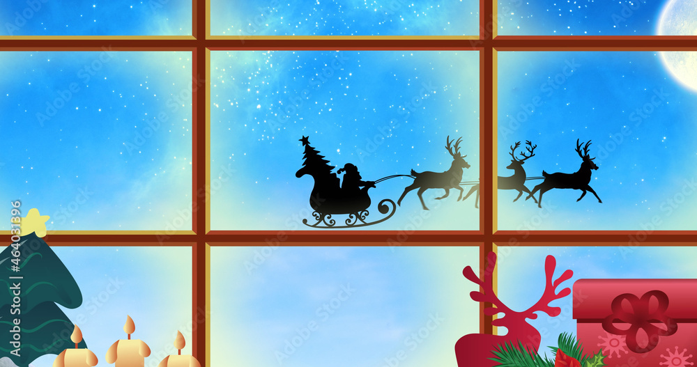 Image of santa claus in sleigh with reindeer seen seen through window