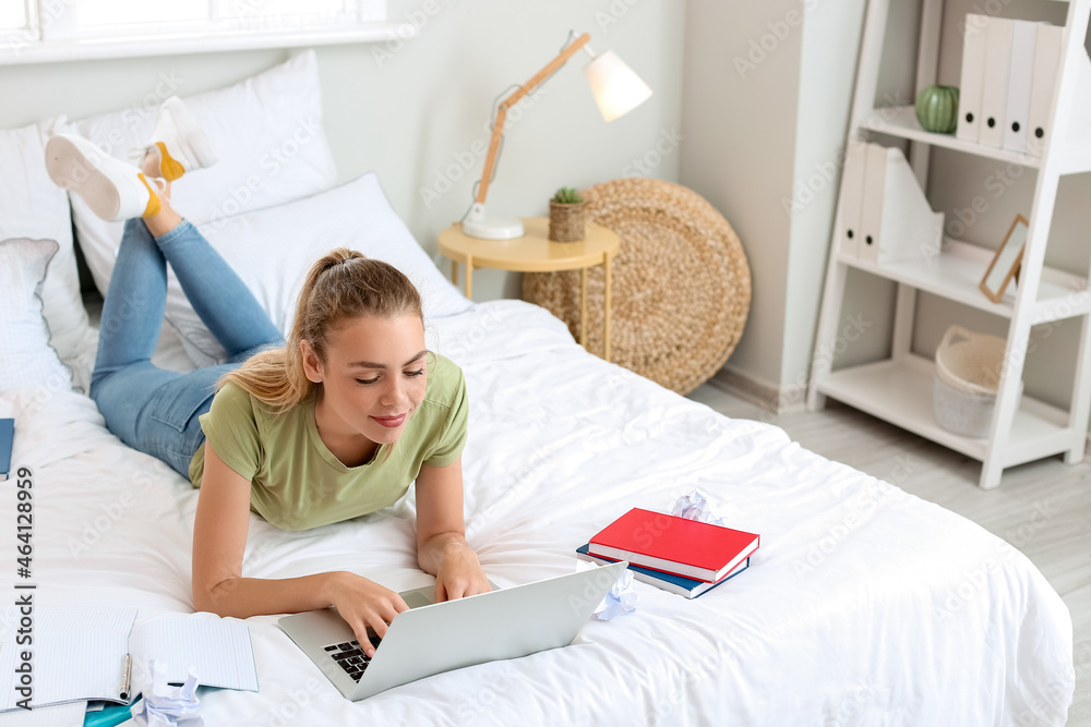 Female student preparing for exam at home