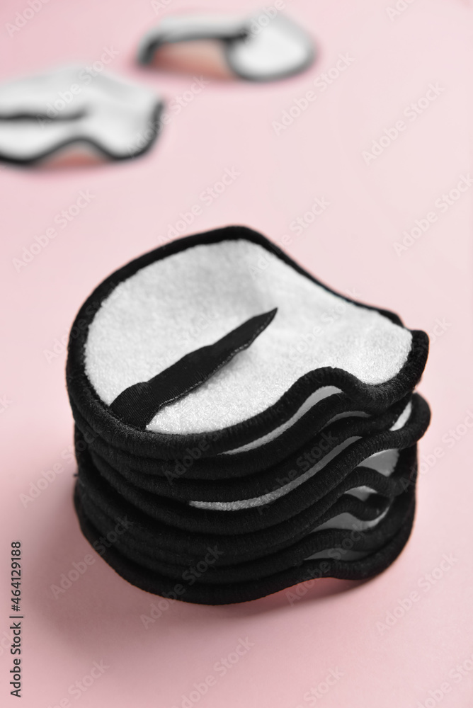 Reusable cotton pads on color background