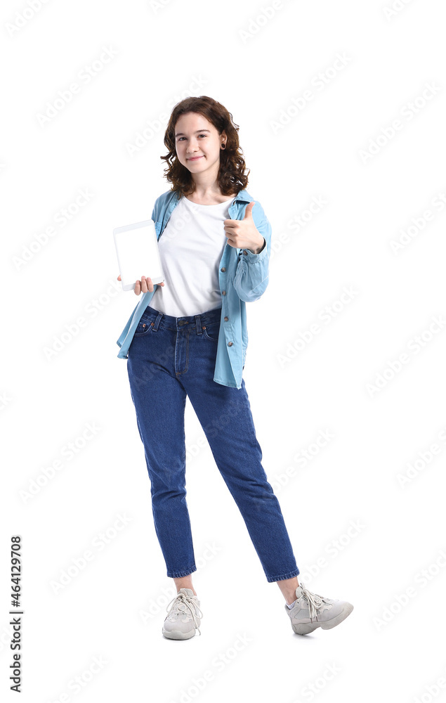 Pretty teenage girl with tablet computer showing thumb-up on white background