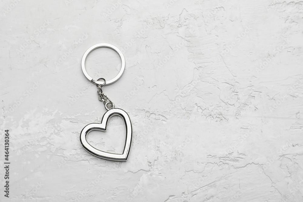 Heart shape keychain on light background