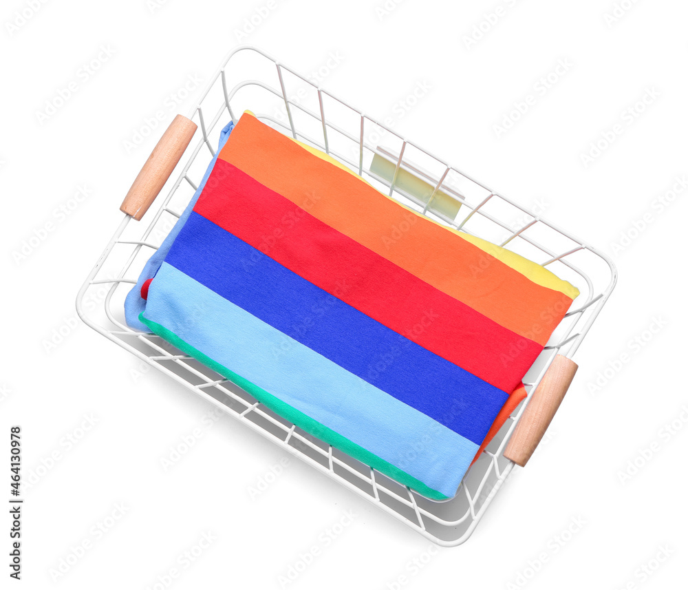 Basket with clean clothes on white background