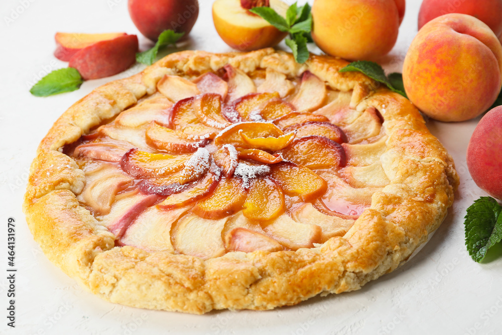 Tasty peach galette on light background, closeup