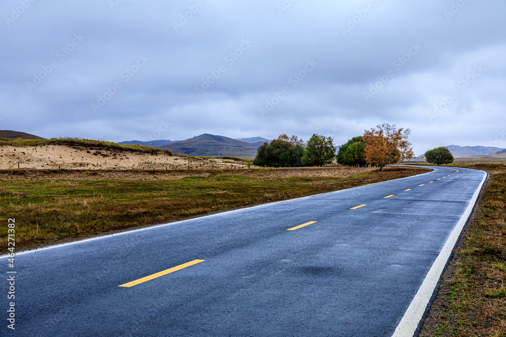 Empty asphalt road pavement and sky clouds on a cloudy day.Road ground scene after rain.