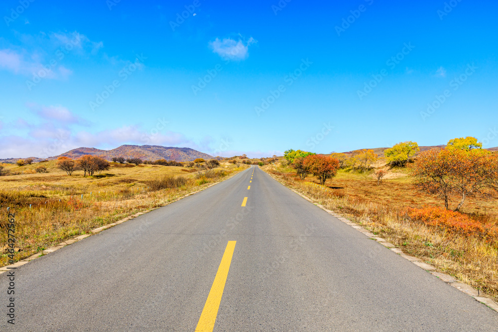 Empty asphalt road ground under blue sky.