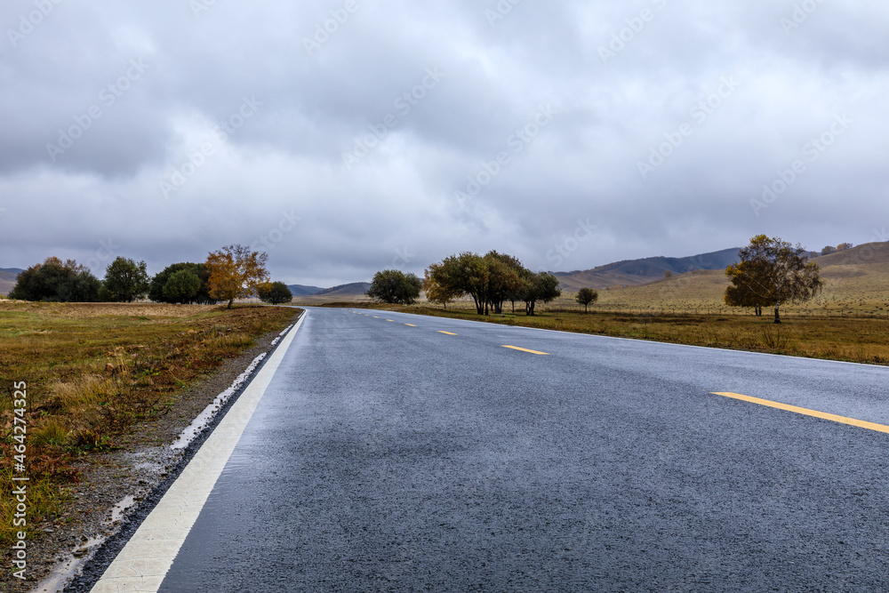 Empty asphalt road pavement and sky clouds on a cloudy day.Road ground scene after rain.