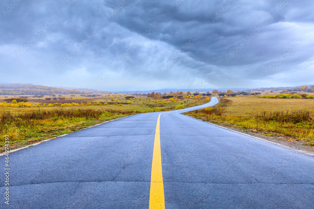 Empty asphalt road pavement and sky clouds on a cloudy day.Road ground scene after rain.