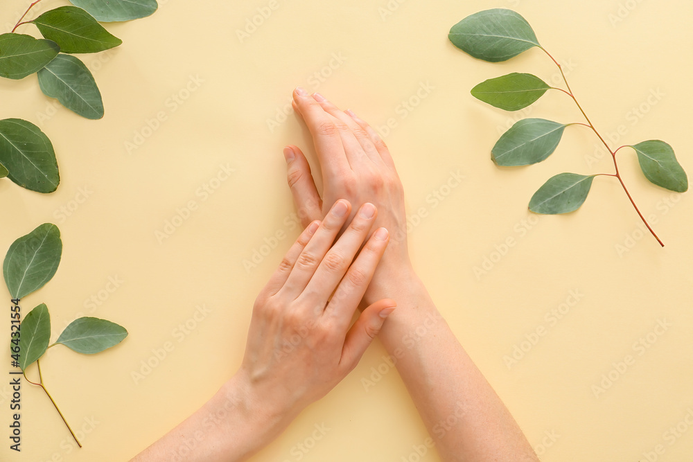 Female hands on light background