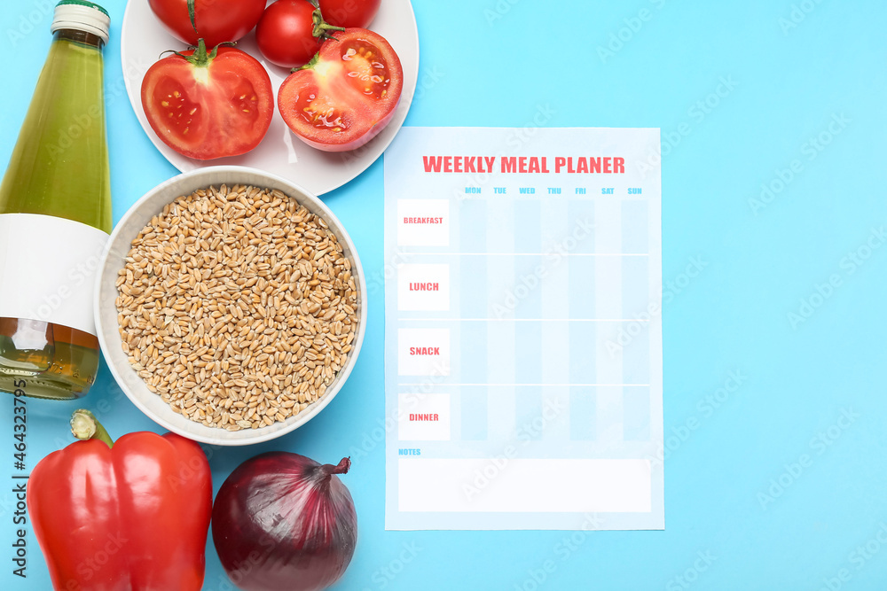 Healthy products with meal plan on color background