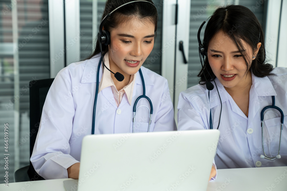 Doctor wearing headset talking actively on video call in hospital or clinic . Concept of telehealth 